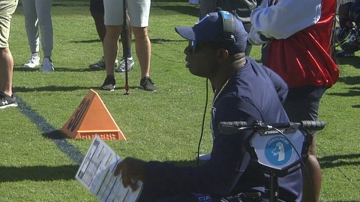 Deion Sanders on Quakillac Scooter